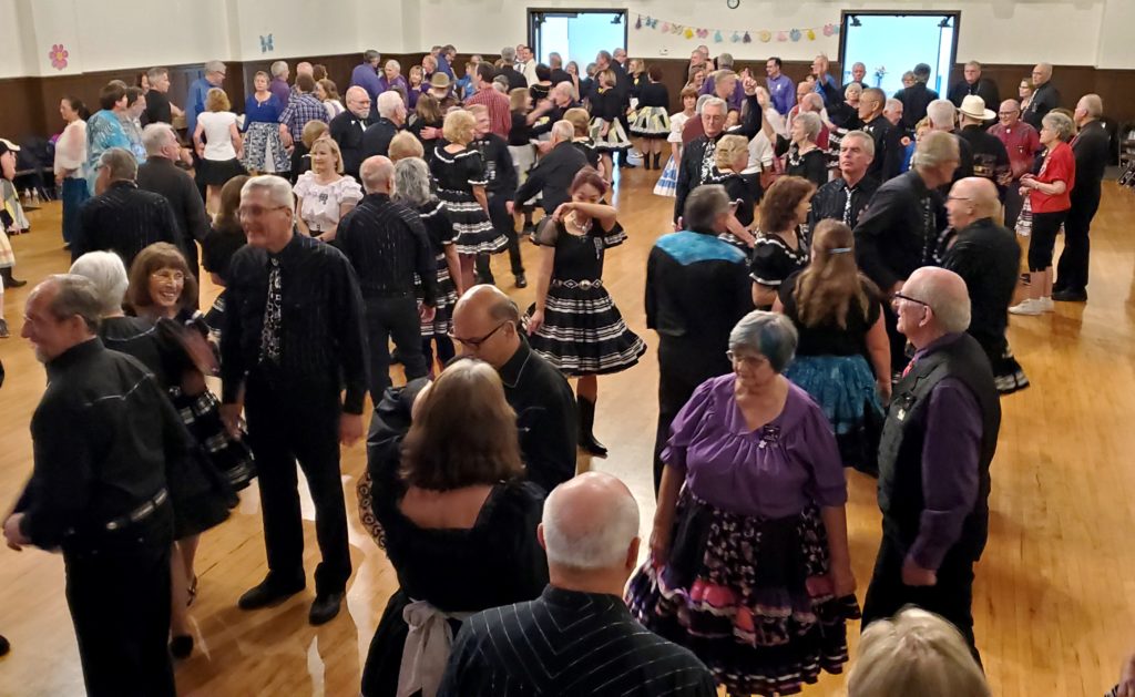 Square dancers filling the dance floor at Solvang Memorial Hall