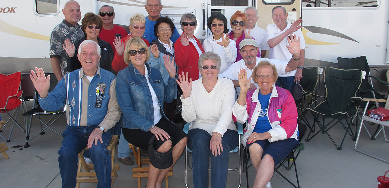 Orange Coast Lariats friends posing together outside at a festival trip